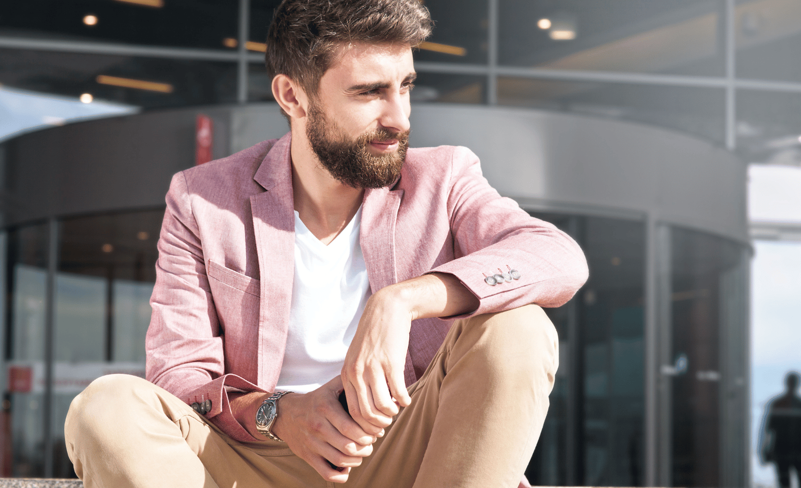 Clean Cut Kenny hero image - man in pink suit jacket and khaki pants
